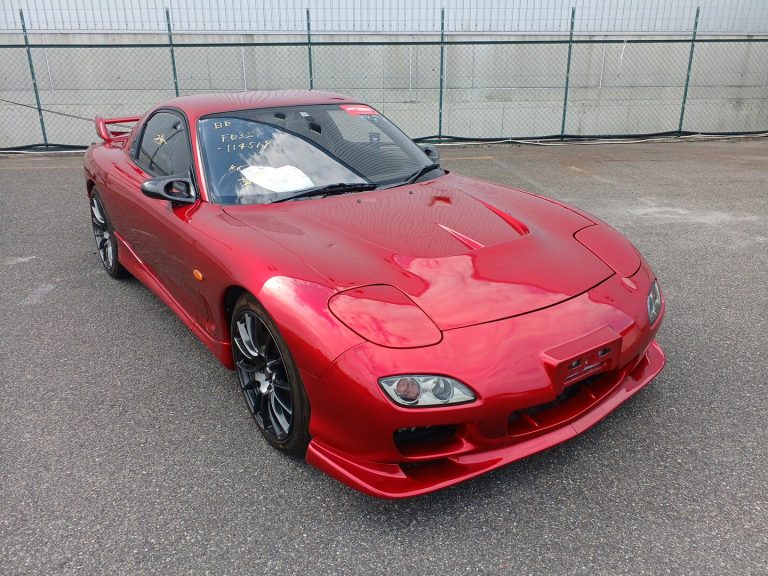 Red Mazda RX-7 FD at a Japanese auction yard